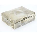 A silver table top cigarette box hallmarked Birmingham 1930 maker W T Wiseman.