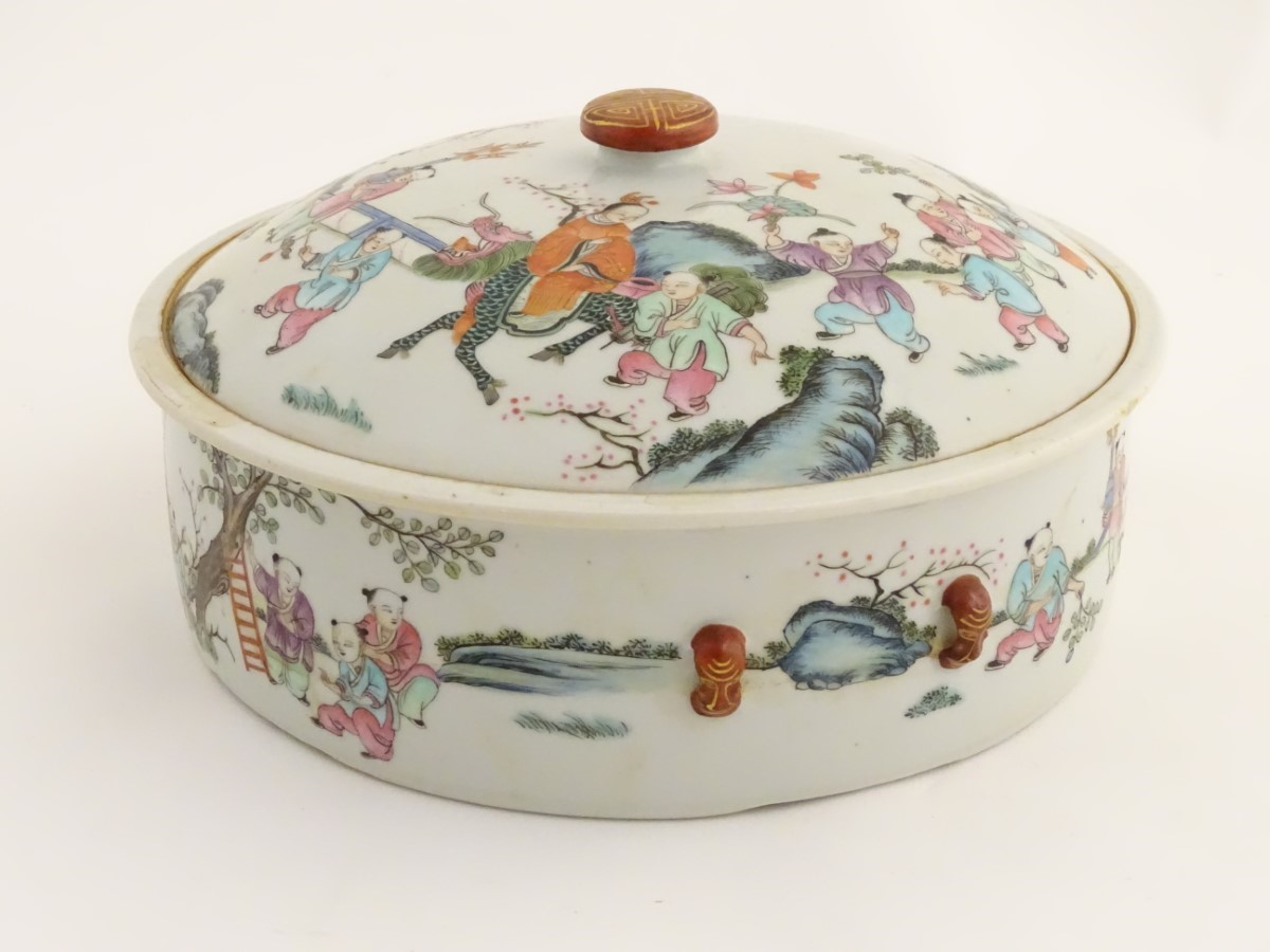 A Chinese lidded pot decorated with figures in a garden with flowers, fruit, vases etc. - Image 4 of 8