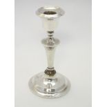 A silver candlestick hallmarked Birmingham 1916 maker A J Pepper & Co.