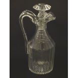 A 19thC Irish cut glass decanter and stopper, having a panelled body with ribbed neck,