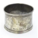 A silver napkin ring hallmarked London 1934 maker J W Benson Ltd.