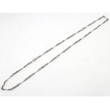 A silver watch chain approx 30" long CONDITION: Please Note - we do not make