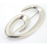 A Mexican silver brooch of abstract form 3" wide CONDITION: Please Note - we do