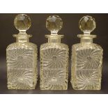 A trio of early 20thC glass decanters,