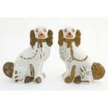 A pair of large Staffordshire flat back spaniel dogs, with gilt chain collar detail.