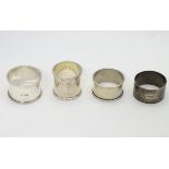 Four assorted silver napkin rings including an example hallmarked Sheffield 1925 maker Walker &