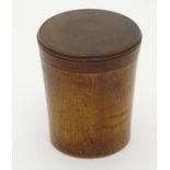 19thC Treen: a turned boxwood cylindrical container with screw fitting lid, 3 1/8" high.
