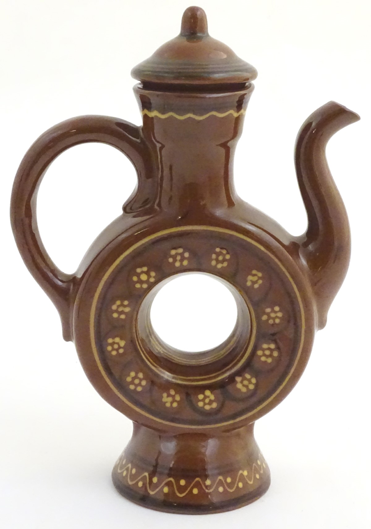 An slipware lidded wine ewer with a ring shaped body on a flared foot, with hand painted decoration. - Image 2 of 5