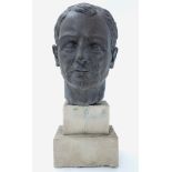 A 20thC composite bust of a man with a bronzed finish mounted on a stepped plinth. Approx.