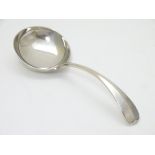 A silver cream ladle hallmarked Birmingham 1971 maker Hampton Utilities.