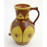 A large earthenware studio pottery baluster vase / jug with single handle,