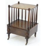 An early 19thC mahogany Canterbury,