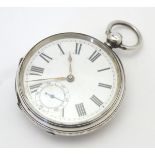 A Victorian silver cased pocket watch with white enamel dial, with subsidiary seconds dial at 6.