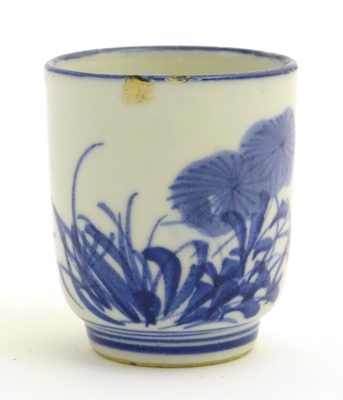 A Japanese blue and white pot with hand painted floral and foliate decoration. - Image 2 of 8