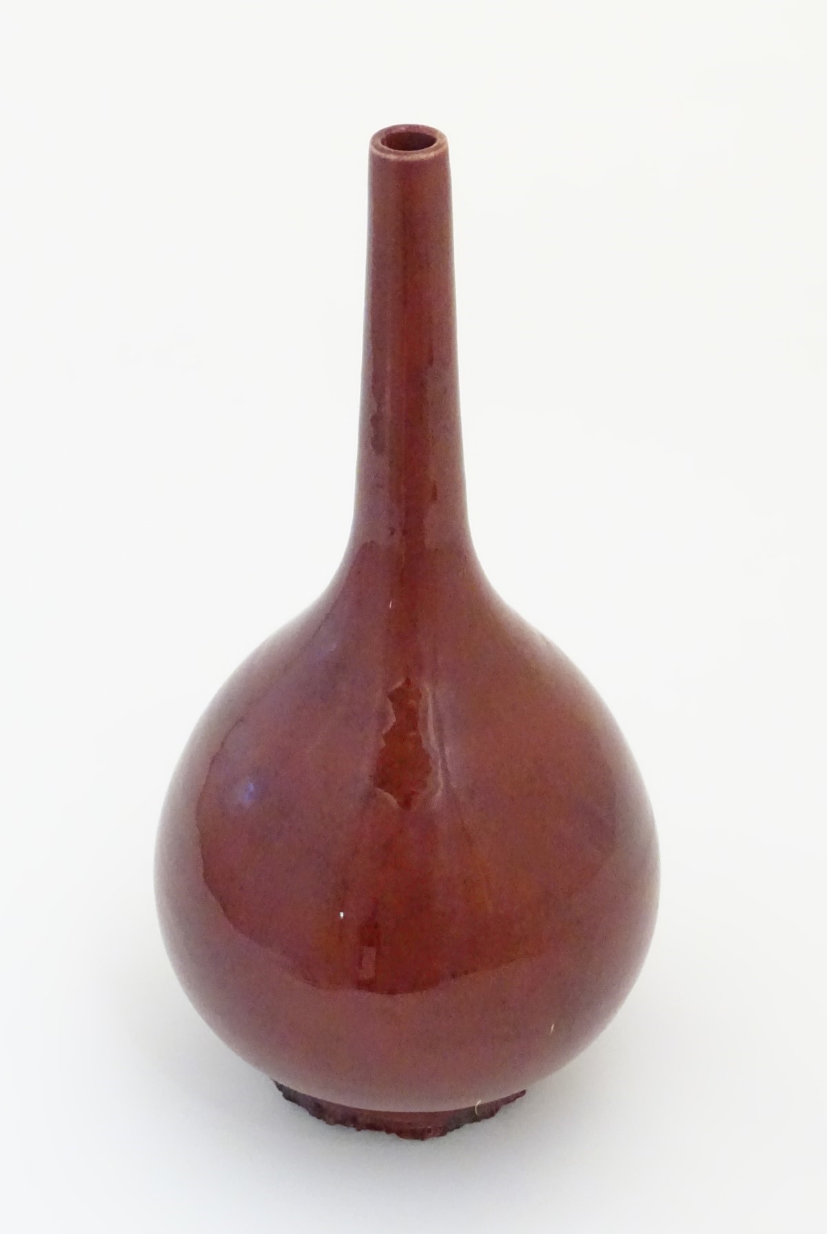 A Chinese pear-shaped vase with a slender, elongated neck with a sang de boeuf glaze. Approx. - Image 2 of 5