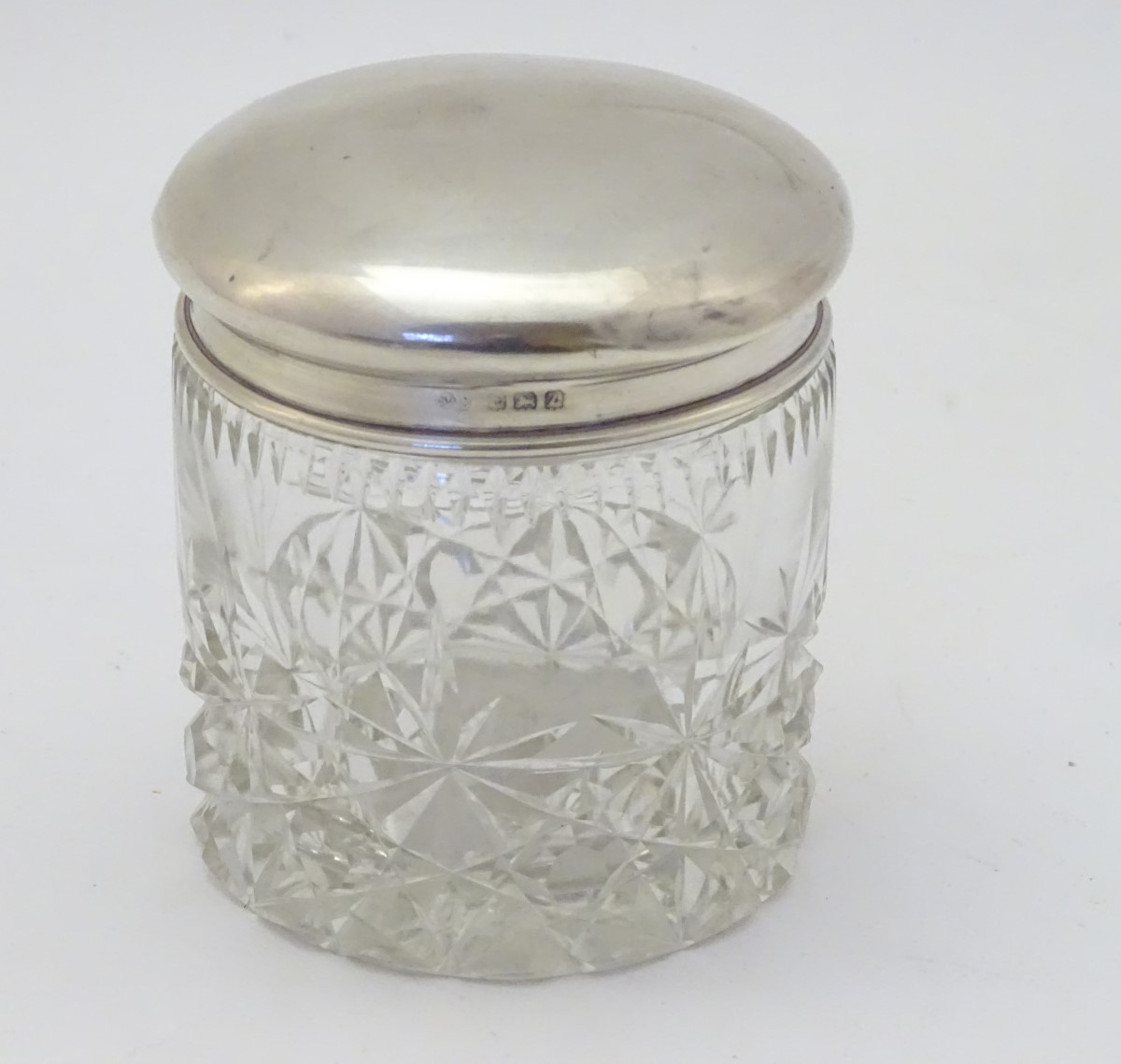 A cut glass dressing table jar with silver top hallmarked Birmingham 1924 maker Sanders & Mackenzie. - Image 3 of 6