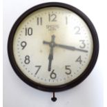 A mid 20thC Bakelite wall clock made by Smiths.