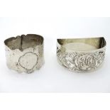 A silver napkin ring with hammered decoration hallmarked Sheffield 1913 maker James Dixon & Sons