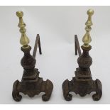 Fire dogs: a pair of 20thC cast iron Andirons / Firedogs,