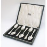 A cased set of 6 Art Deco silver grapefruit spoons hallmarked London 1938 maker Harrods Ltd.