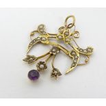 A 9ct gold pedant set with seed pearls and amethyst.