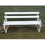 Vintage wrought iron and painted wood slatted bench with open armrests,