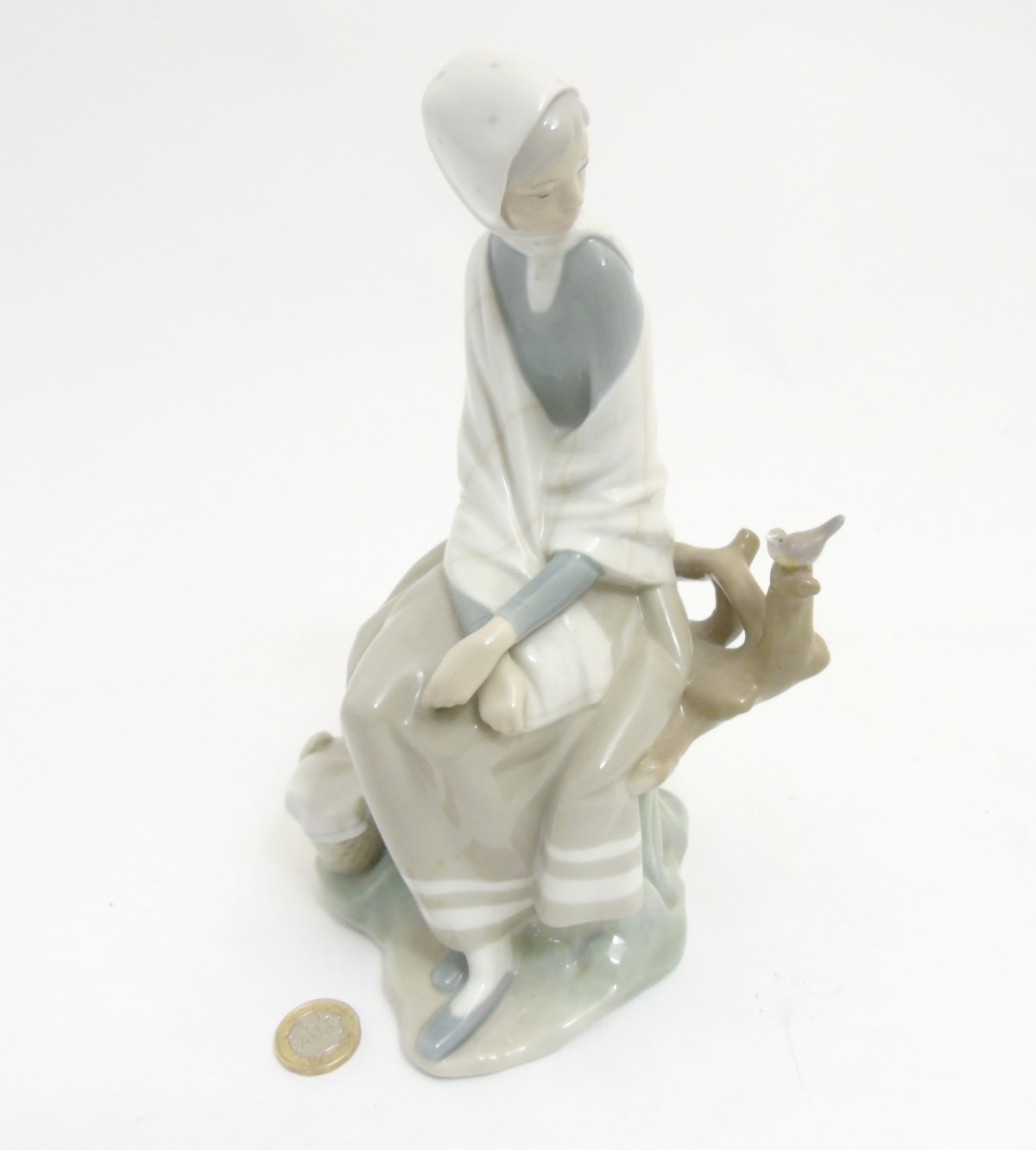 A Lladro 'New Shepherdess' figurine of a girl sat watching a bird, makers mark to base, - Image 4 of 8