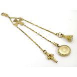 A 19thC gold and yellow metal Albertina watch chain,