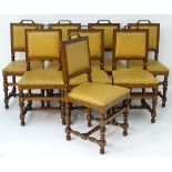 A set of eight mahogany dining chairs with cast brass handles to the top rail,