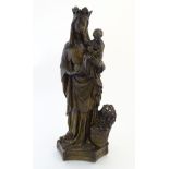A 20thC composite sculpture of the Madonna and Child,