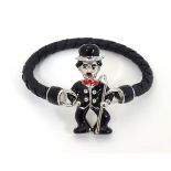 A bracelet by Butler & Wilson with magnetic clasp formed as Charlie Chaplin.