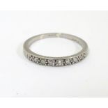 A platinum half eternity ring set with 7 diamonds CONDITION: Please Note - we do