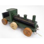 Toy: A scratch built pull along wooden toy train. Approx. 17" long.