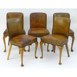 A set of five Art Deco leather upholstered chairs with curved backrests,