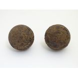 Militaria: a pair of 17thC English Civil War period iron cannonballs,