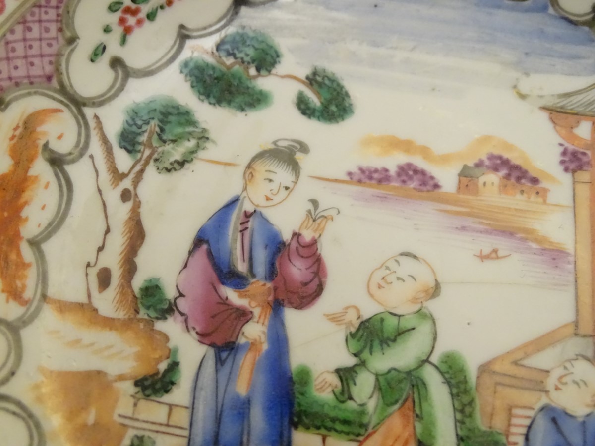 A Chinese famille rose tea bowl and saucer with hand painted decoration depicting figures on a - Image 2 of 7