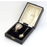 A silver egg cup and spoon hallmarked Birmingham 1954 maker B& Co. Cased.