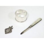 3 items comprising a silver folding fruit knife with mother of pearl handle hallmarked Sheffield