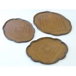 A graduated set of three Art Deco trays with lobed edges. Largest approx.