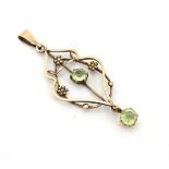 A 9ct gold Art Nouveau pendant set peridot drop.