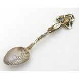 An Art Nouveau Canadian silver souvenir spoon with enamel decoration titled ' Winnipeg Canada.