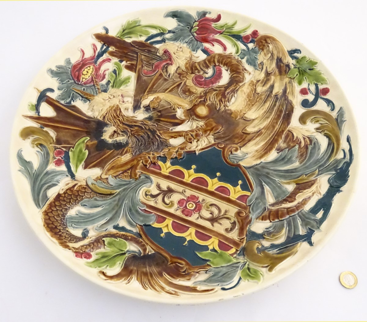 A large 19thC Austrian charger decorated in relief with two fighting griffins / dragons with a - Image 5 of 8