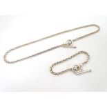 A silver necklace of rope twist form with matching bracelet.