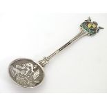 A South African silver souvenir spoon with enamel decoration to handle and tribal figural