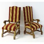 A pair of mid / late 19thC open armchairs with scrolled chamfered arms and standing on shaped legs
