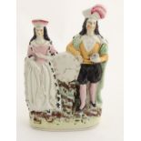 A Victorian Staffordshire figural group depicting the Shakespeare characters Lady Macbeth and