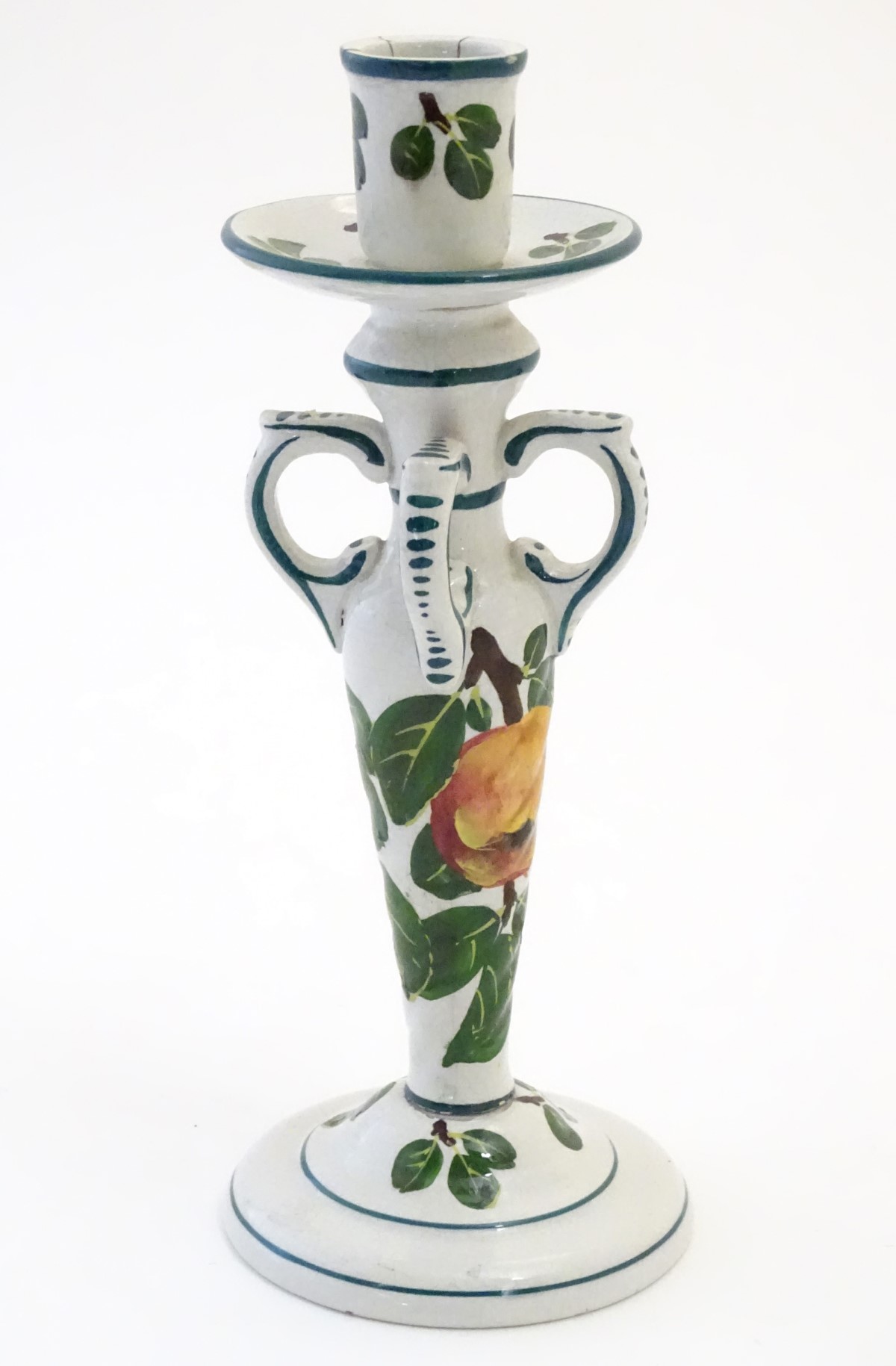 A Wemyss candlestick decorated with apples and leaves. Impressed Wemyss Ware under. Approx.