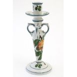 A Wemyss candlestick decorated with apples and leaves. Impressed Wemyss Ware under. Approx.