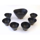 7 unusual modernist wooden ebonised bowls on Sterling silver circular bases.