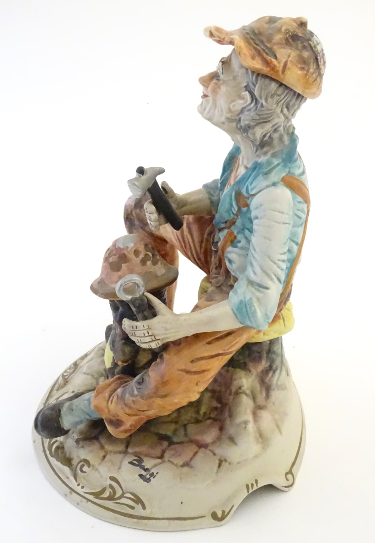 A Capodimonte figure of an elderly man with tools, possibly an armourer. - Image 4 of 7